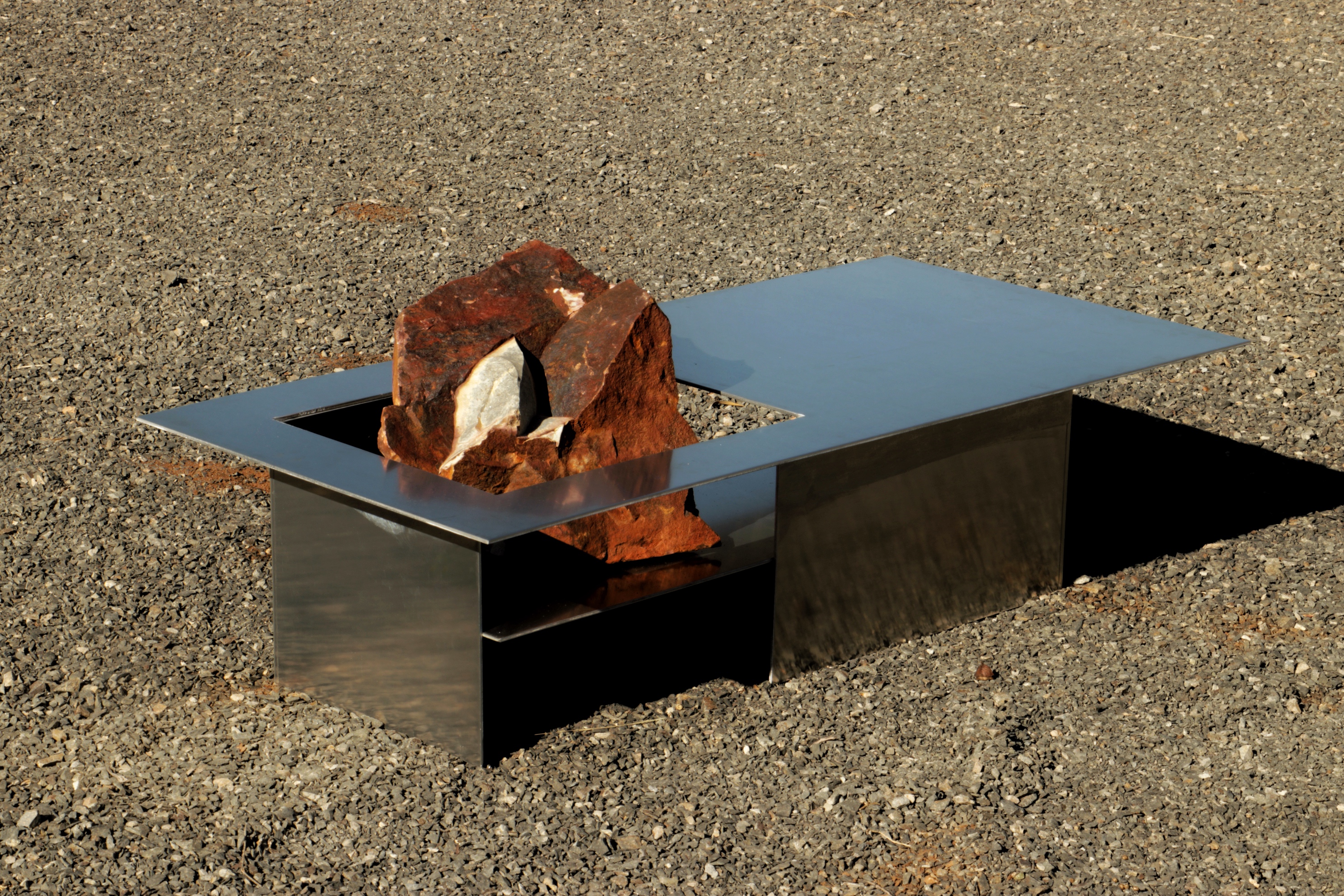 Alust — Coffee table with boulder